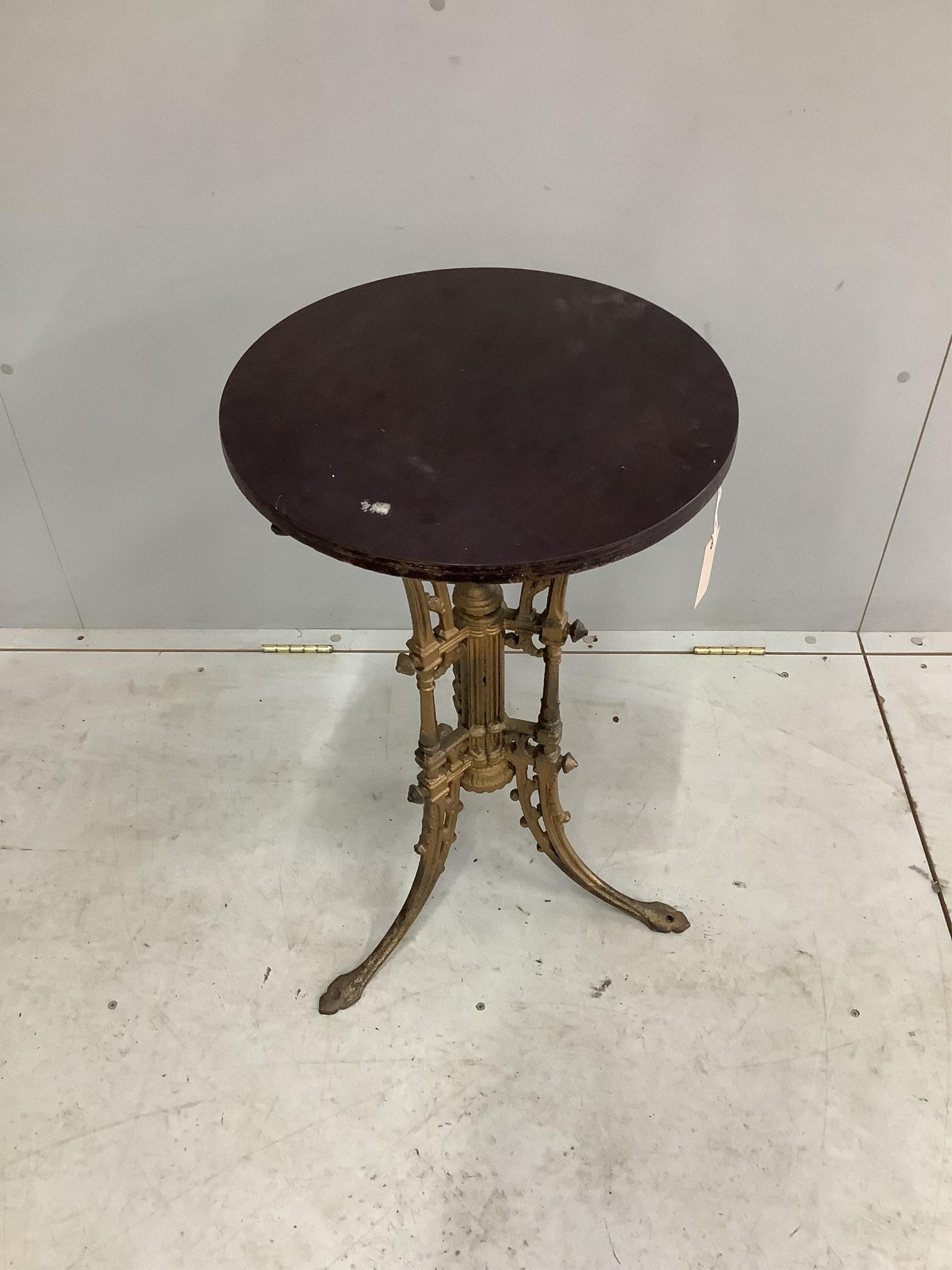 A Victorian gold painted cast iron occasional table with later top, diameter 43cm, height 73cm. Condition - fair